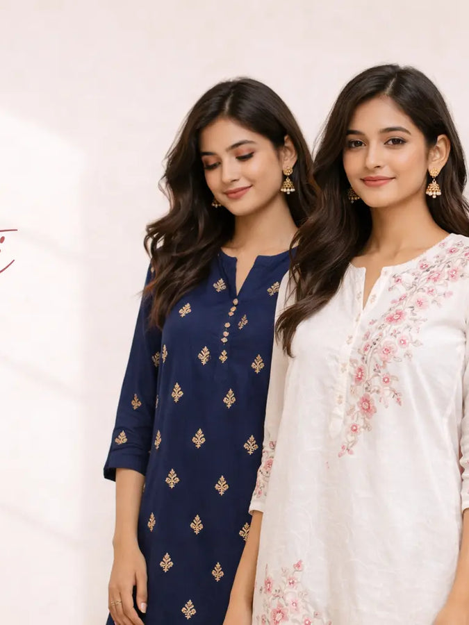 Indian women wearing elegant kurtis with embroidery and traditional styling in a soft neutral background.