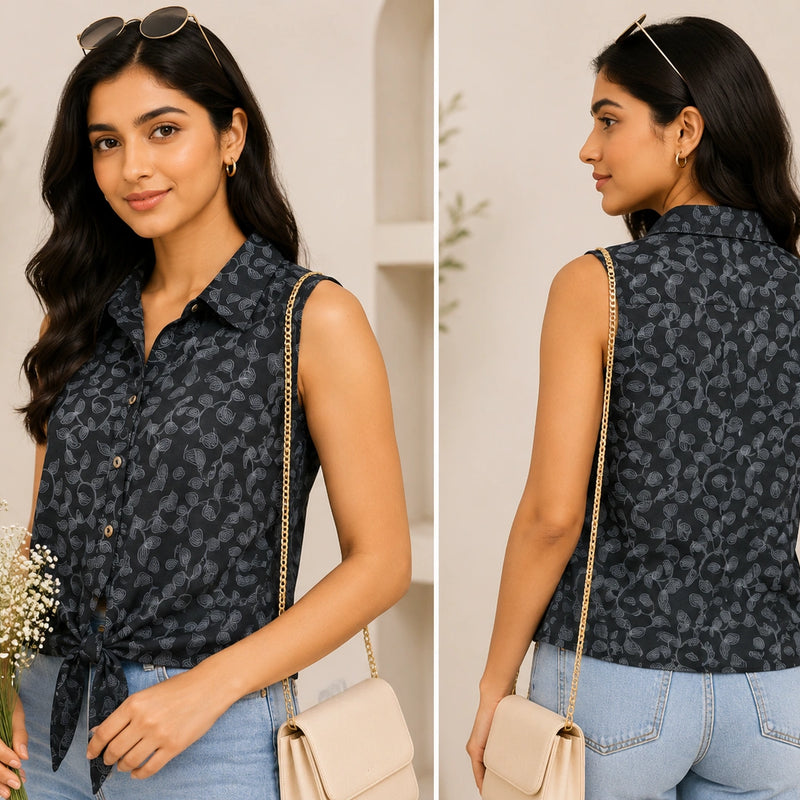 Woman wearing a sleeveless patterned top with denim shorts, holding flowers and a handbag.
