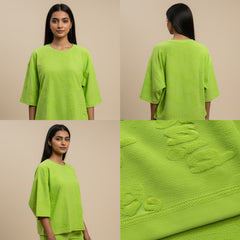 Green oversized t-shirt shown from front, back, and close-up on a beige background