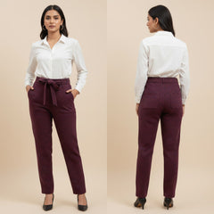Woman wearing a white shirt and maroon pants, shown from front and back on a beige background