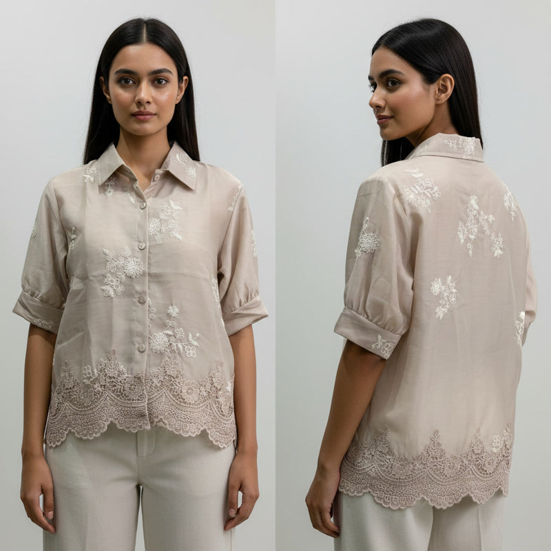 Woman wearing a beige blouse with floral embroidery, shown from front and back.