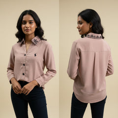 Woman wearing a pink shirt with a brand logo, shown from front and back on a beige background