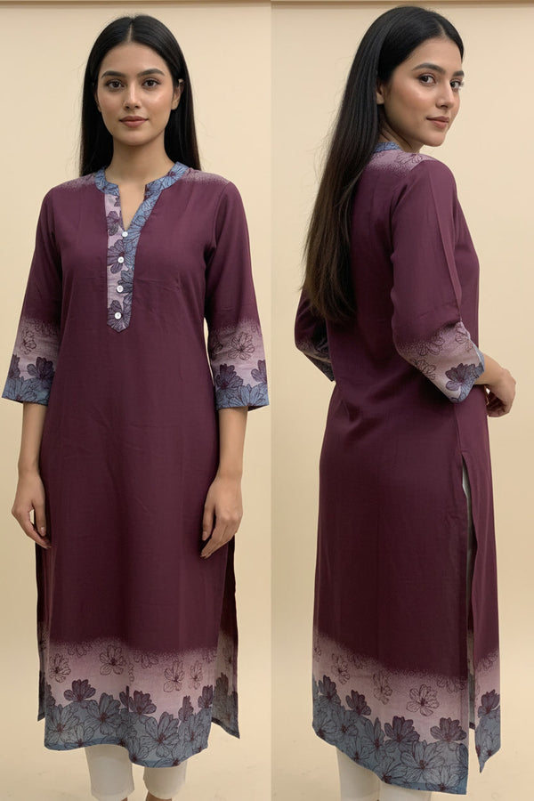 Woman wearing a maroon kurta with floral patterns on a beige background