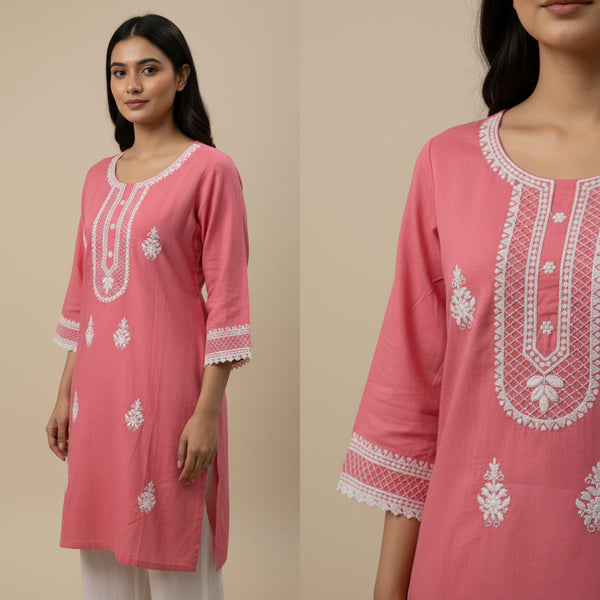 Pink embroidered kurta worn by a model on a beige background