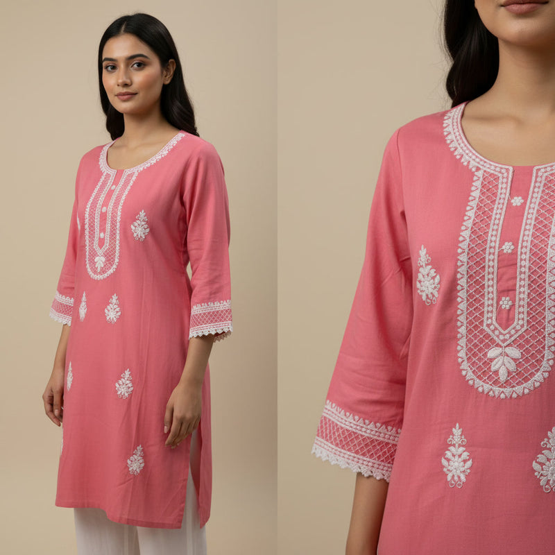 Pink embroidered kurta worn by a model on a beige background