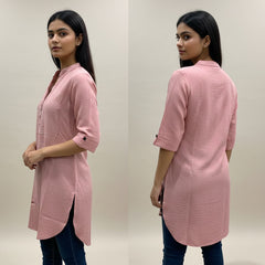 Woman wearing a pink kurta from front and back views against a plain background