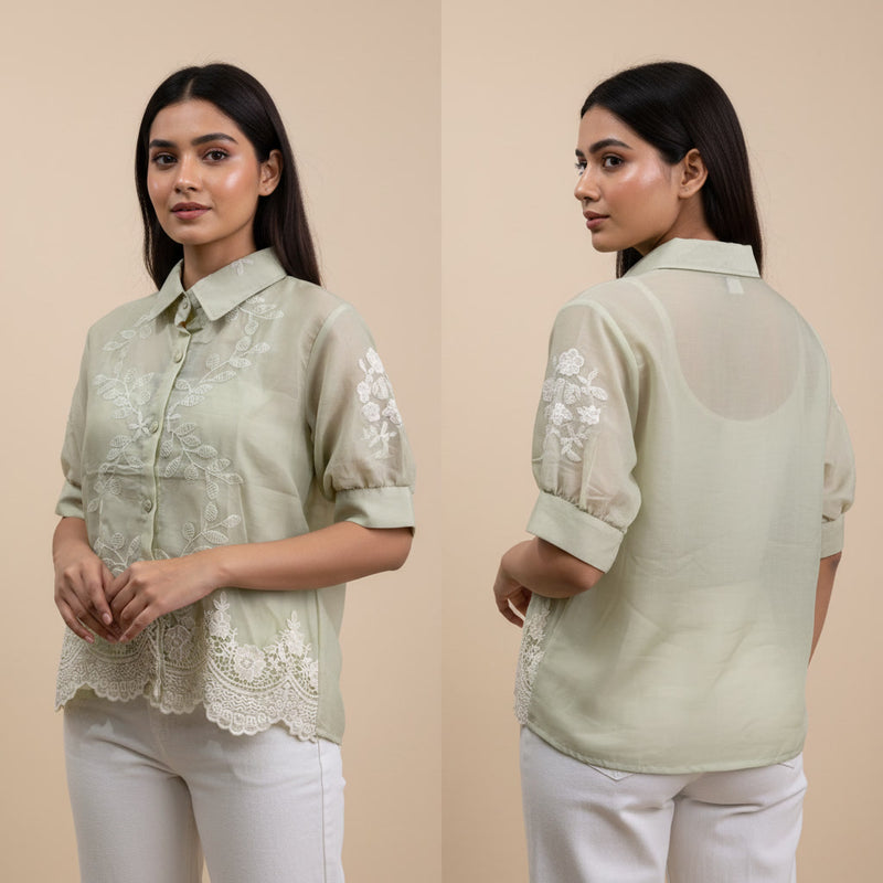 Woman wearing a light green blouse with lace details, shown from front and back on a beige background.