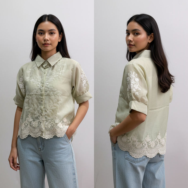 Woman wearing a light green blouse with lace details and light blue jeans, shown from front and back.