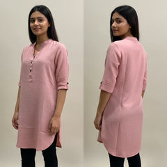 Woman wearing a pink kurta from front and back views against a plain background
