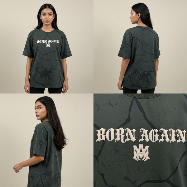 Dark green t-shirt with 'Born Again' text worn by a model on a beige background