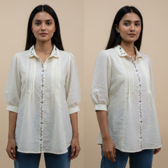 Woman wearing a white blouse with decorative buttons on a beige background