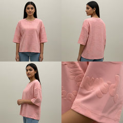 Pink sweater with floral embroidery worn by a person, shown from front, back, and close-up views.