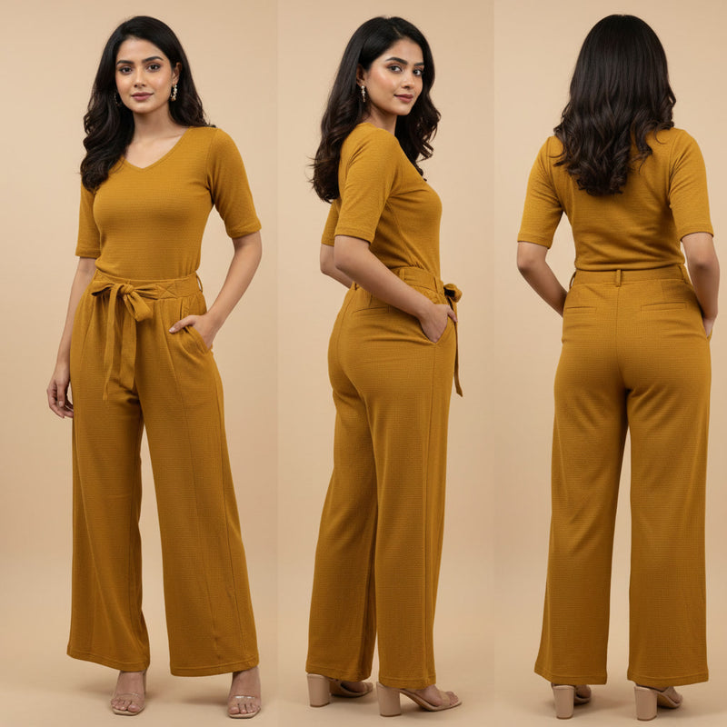 Woman wearing a mustard yellow jumpsuit from front, side, and back views on a beige background