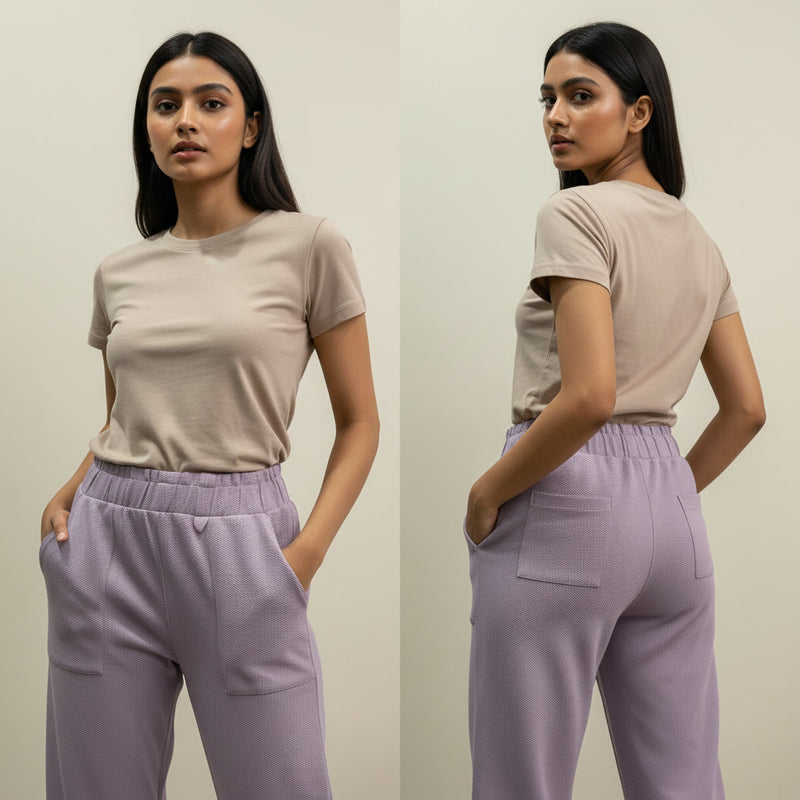 Woman wearing a beige t-shirt and lavender pants, shown from front and back on a plain background.