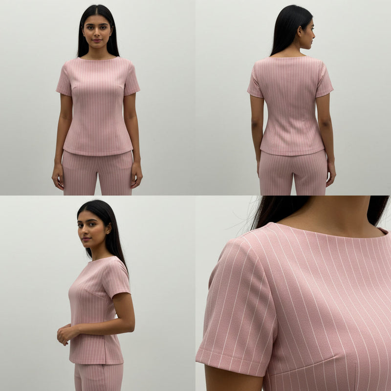 Pink pinstripe outfit worn by a model on a white background