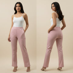 Woman wearing pink pants and a white top on a beige background