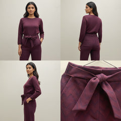 Maroon outfit with a belt worn by a model on a plain background