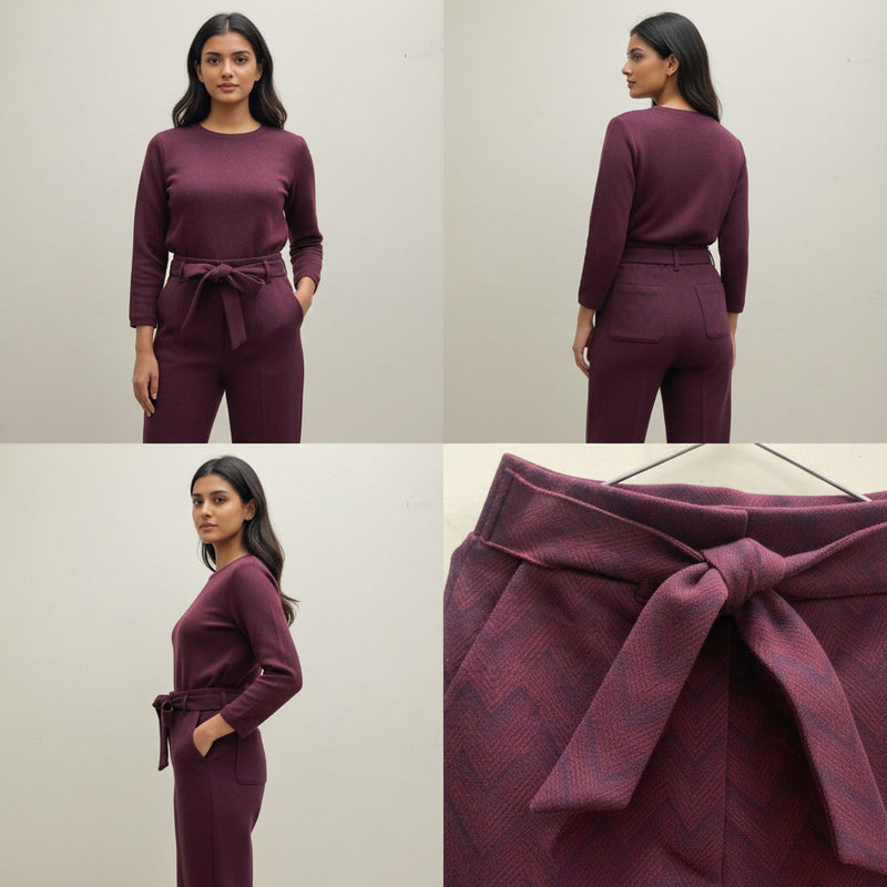 Maroon outfit with a belt worn by a model on a plain background