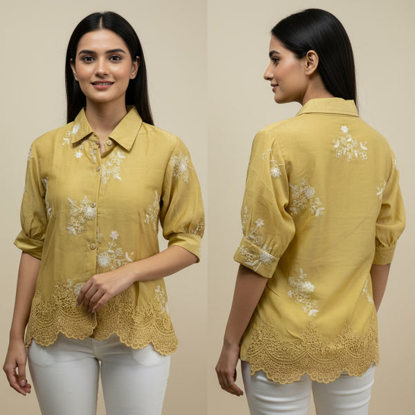Woman wearing a yellow embroidered shirt with lace details, shown from front and back on a beige background.